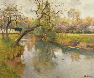 Paesaggio fluviale francese con un albero in fiore