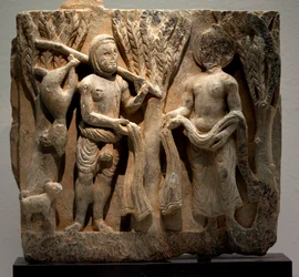 Scambio di vestiti con un cacciatore. Bassorilievo scolpito, arte del Gandhara (Pakistan), II-III secolo. Museo Nazionale della Corea, Seoul (Corea del Sud)