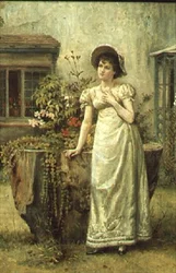 Giovane donna accanto a un ceppo d
