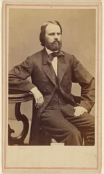 [Uomo non identificato con barba folta, seduto]