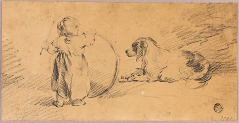 Bambino che gioca con palla e cane