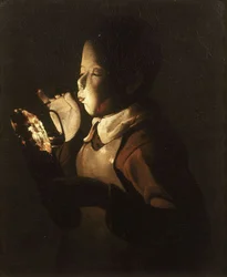 Ragazzo che soffia sulla lampada