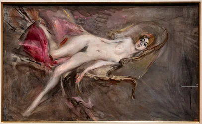 Donna nuda su cuscini rosa