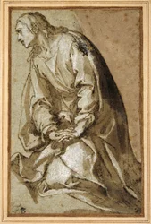 Un giovane santo in ginocchio in preghiera