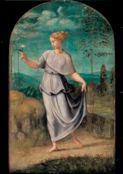 Giovane donna che tiene un fiore con un ampio paesaggio oltre