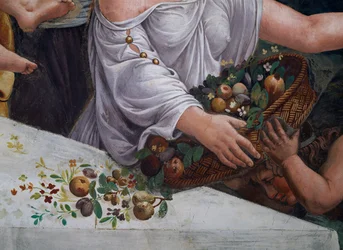 Un cesto di frutta e fiori (dettaglio del banchetto rustico)