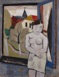 Nudo vicino a una finestra