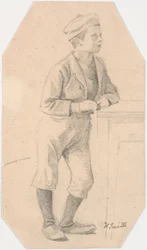 Ragazzo appoggiato a un tavolo