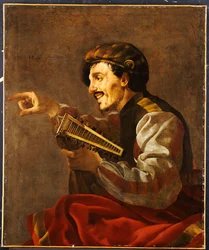 Un liutista seduto che indica