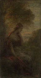 Giovane donna sotto un albero al tramonto
