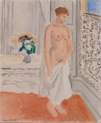 Nudo in piedi vicino alla finestra