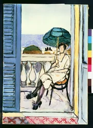 Donna con ombrellone verde su un balcone