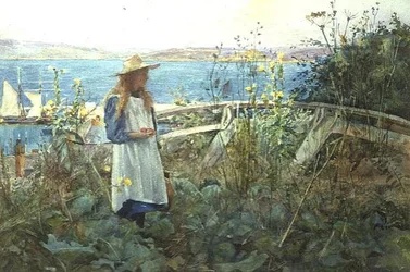 Una ragazza in un giardino vicino al mare