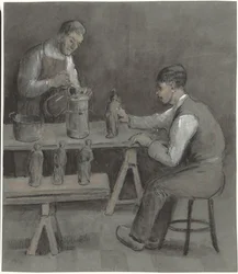 Due lavoratori che fanno statuette