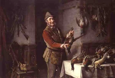 Cacciatore con un fagiano e altra selvaggina