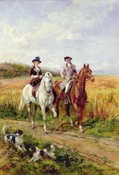 Coppia a cavallo con i loro cani