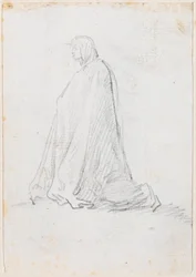 Figura inginocchiata in un mantello con cappuccio