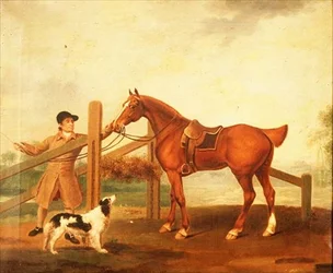 Un groom che conduce un cavallo da caccia baio