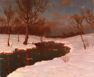 Tramonto su un paesaggio fluviale innevato