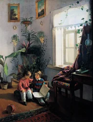 Bambini che sfogliano un libro illustrato