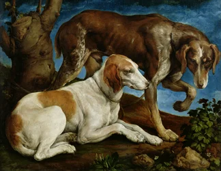 Due cani da caccia legati a un ceppo d