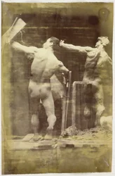 Studio di un modello maschile nudo, visto di schiena e con la mano in una struttura, accanto a un modello in gesso nella stessa posa, nell