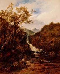 Pescatore presso una cascata boschiva