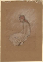 Donna seduta con capelli rossi