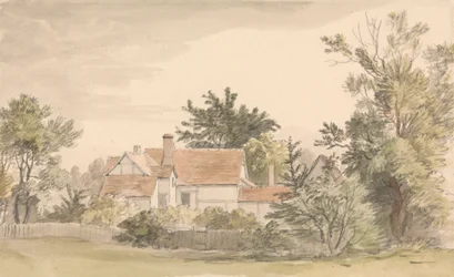Cottage e alberi con una recinzione