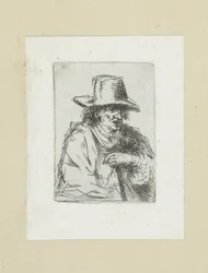Uomo con cappello alto e bastone