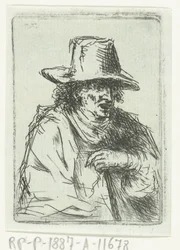 Uomo con cappello alto e bastone