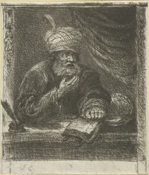 Uomo con turbante dietro un tavolo da scrittura