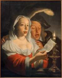 Coppia che canta alla luce delle candele