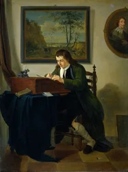 Un uomo che scrive alla sua scrivania