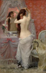 Giovane donna nuda che si pettina in un interno