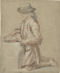 Ragazzo con cappello di feltro vicino a un bacino
