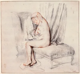 Donna nuda seduta su una chaise longue, che si mette la camicia