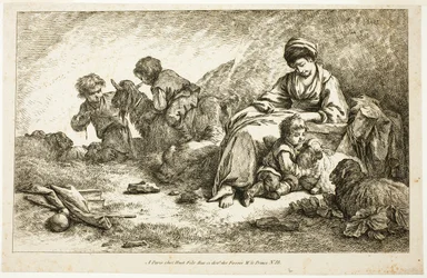 Madre e figli con le pecore