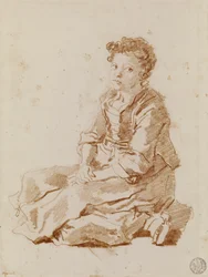 Bambina seduta per terra