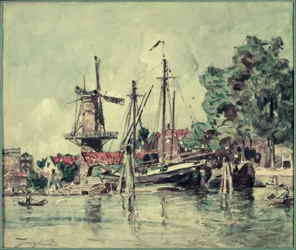 In Olanda, le barche vicino al mulino
