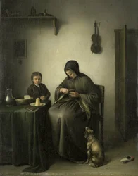 Una donna che affetta il pane
