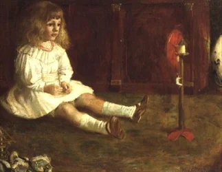 Bambino con un giocattolo meccanico