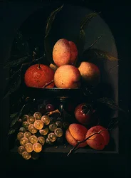 Una tazza di frutta in una nicchia di pietra