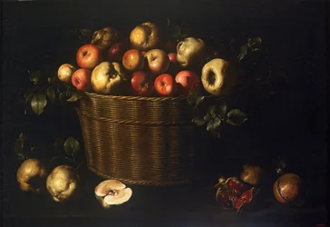 Cestino con mele, mele cotogne e melograni