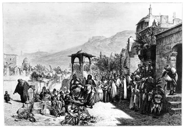 Distribuzione di datteri in un cimitero al Cairo