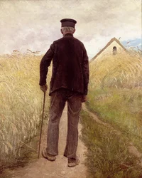 Vecchio che cammina in un campo di segale