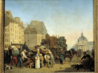 Traslochi parigini durante un cambio di alloggio caricano un carro con affari e mobili in una strada di Parigi