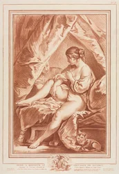 Giovane donna seduta su un letto