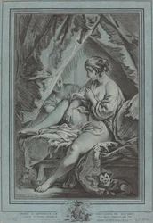 Giovane donna seduta su un letto