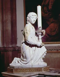 Angelo che tiene una candela